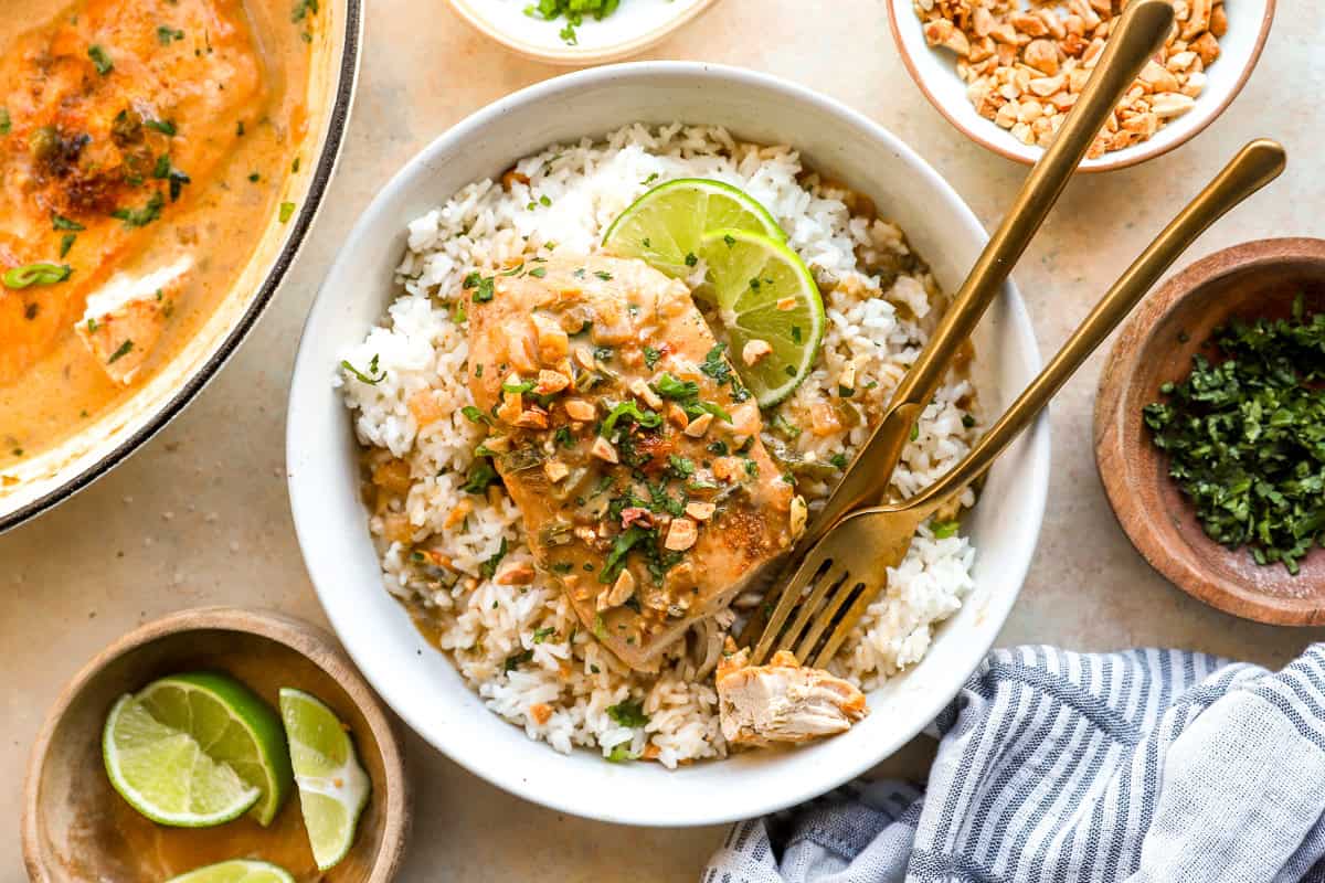coconut chicken served in a bowl with lime garnish