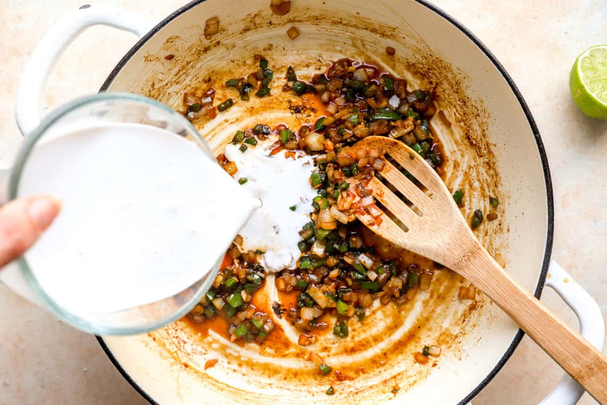 coconut chicken sauce being made in a pot