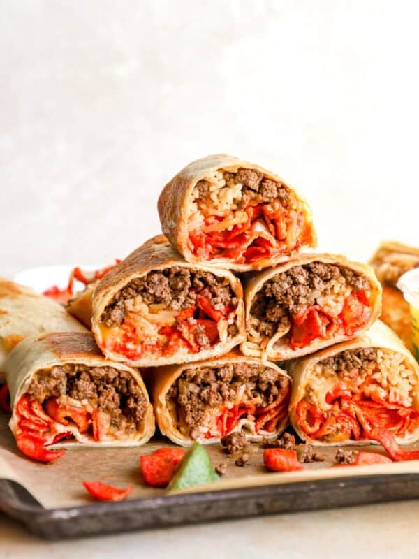 Stack of sliced Flamin’ Hot grilled cheese burritos filled with seasoned beef, taco rice, melted cheese, and Flamin’ Hot Fritos.