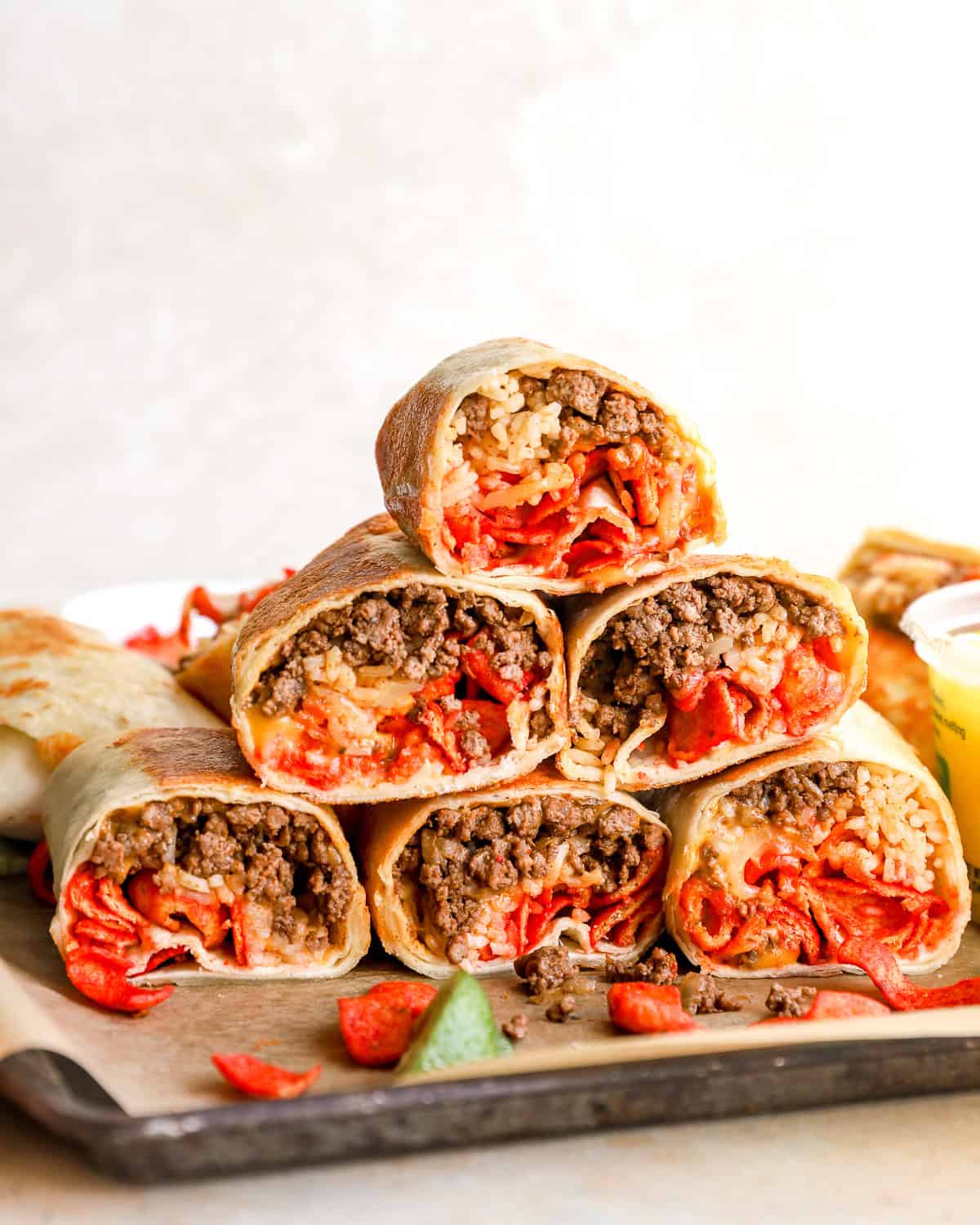 Stack of sliced Flamin’ Hot grilled cheese burritos filled with seasoned beef, taco rice, melted cheese, and Flamin’ Hot Fritos.