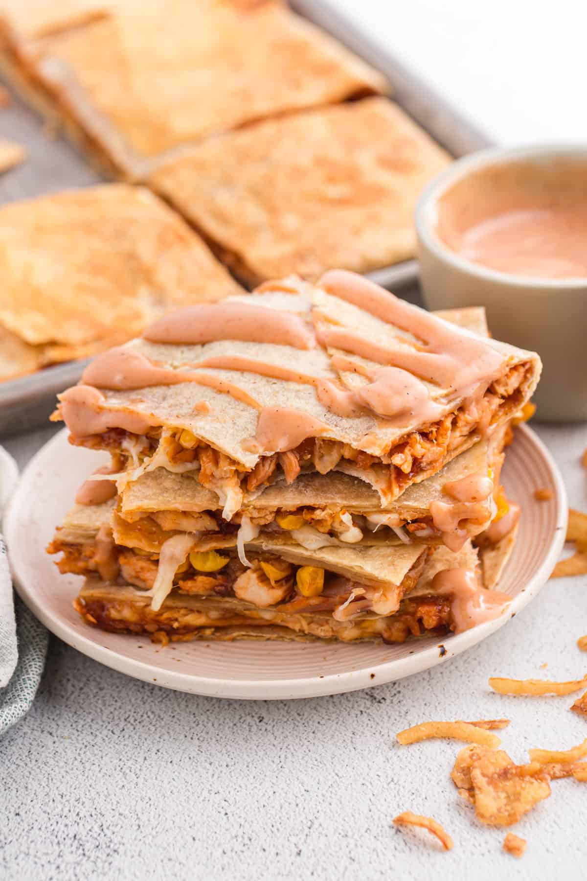 bbq chicken crunch wraps stacked with sauce