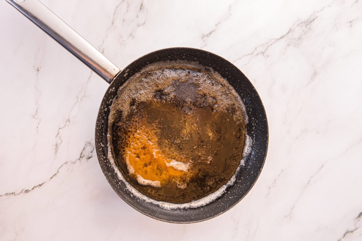 Butter melting and foaming in a saucepan as it starts to brown